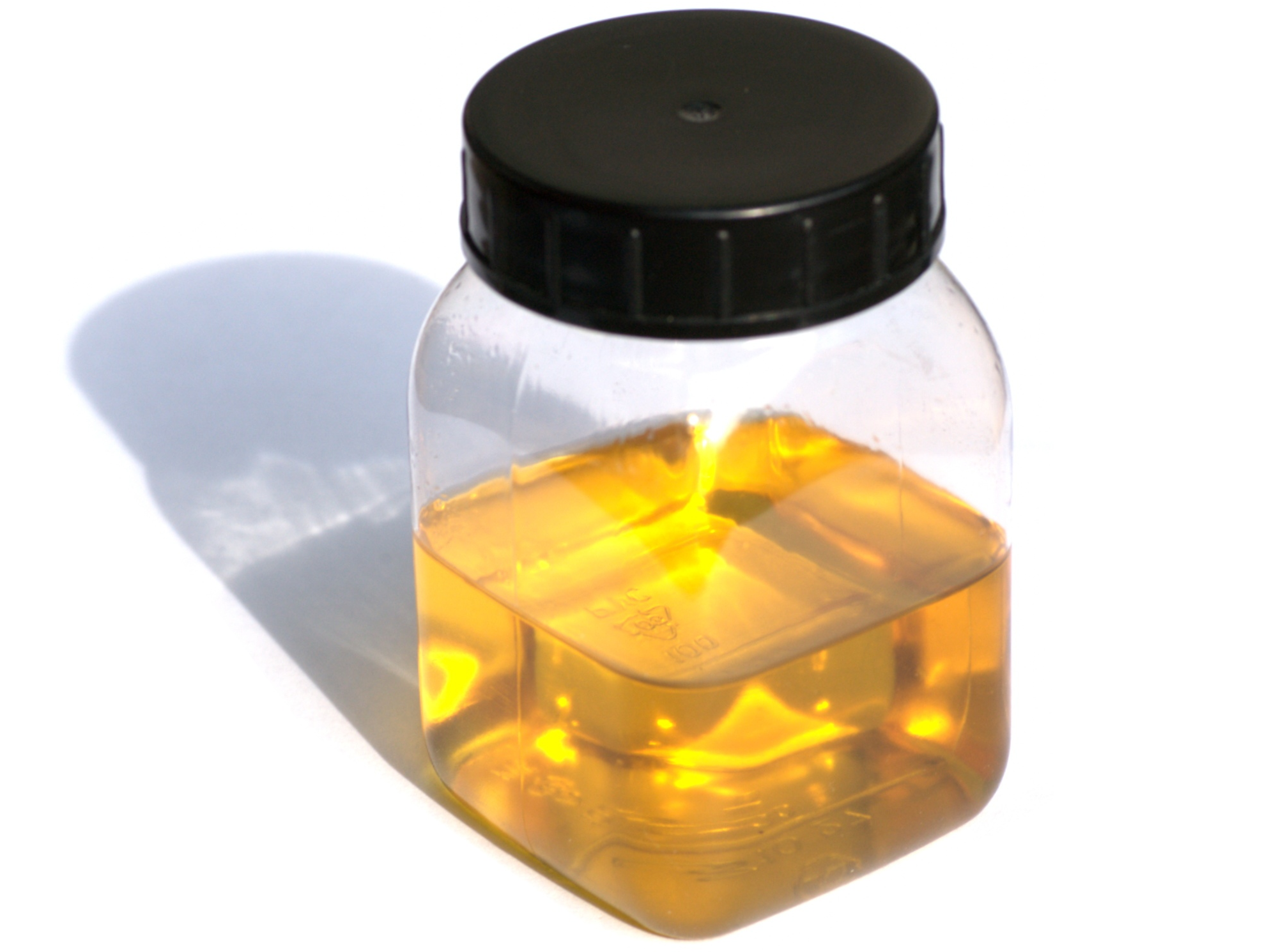 Un barattolo trasparente contenente gommalacca in formato liquido