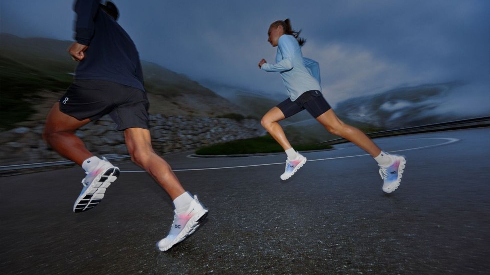 Two runners in action with the On Cloudprime carbon shoes