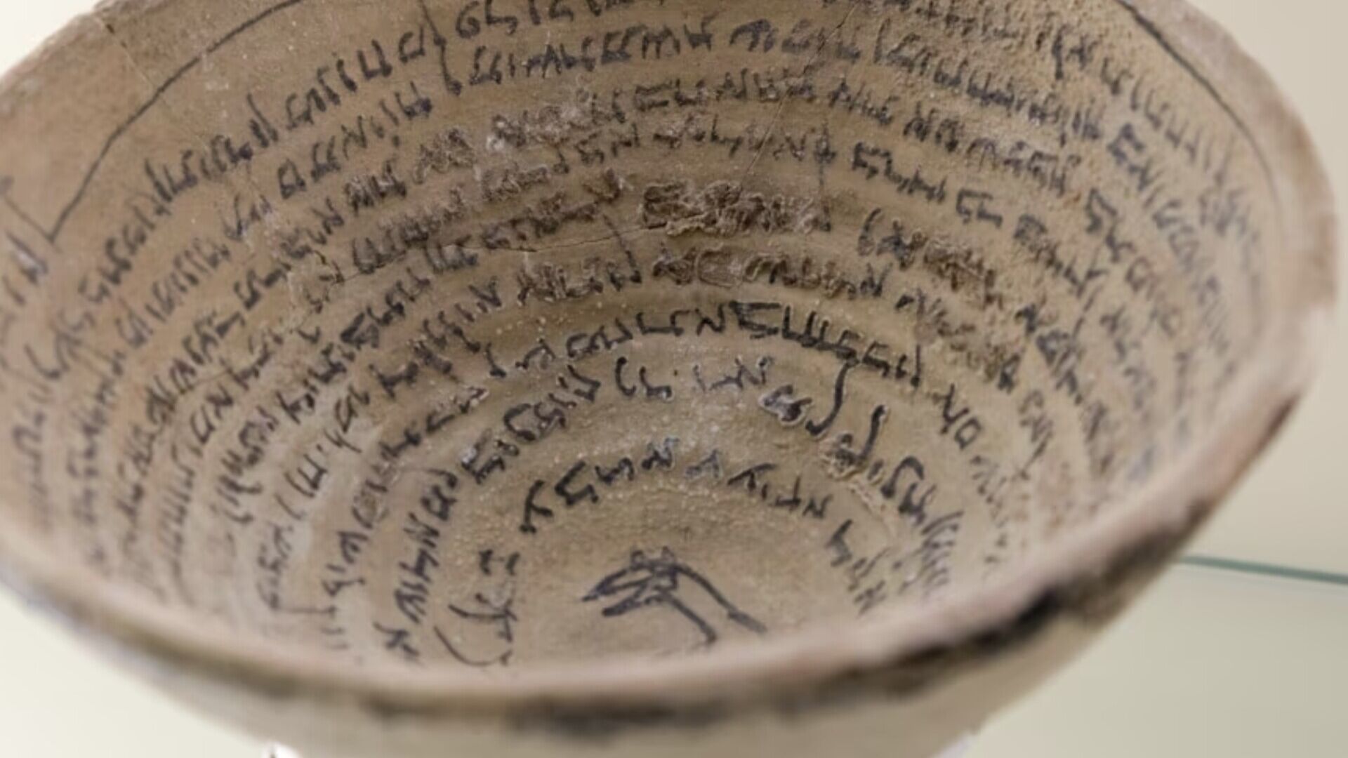 Cuneiform: A representation of cuneiform writing on an Akkadian vase