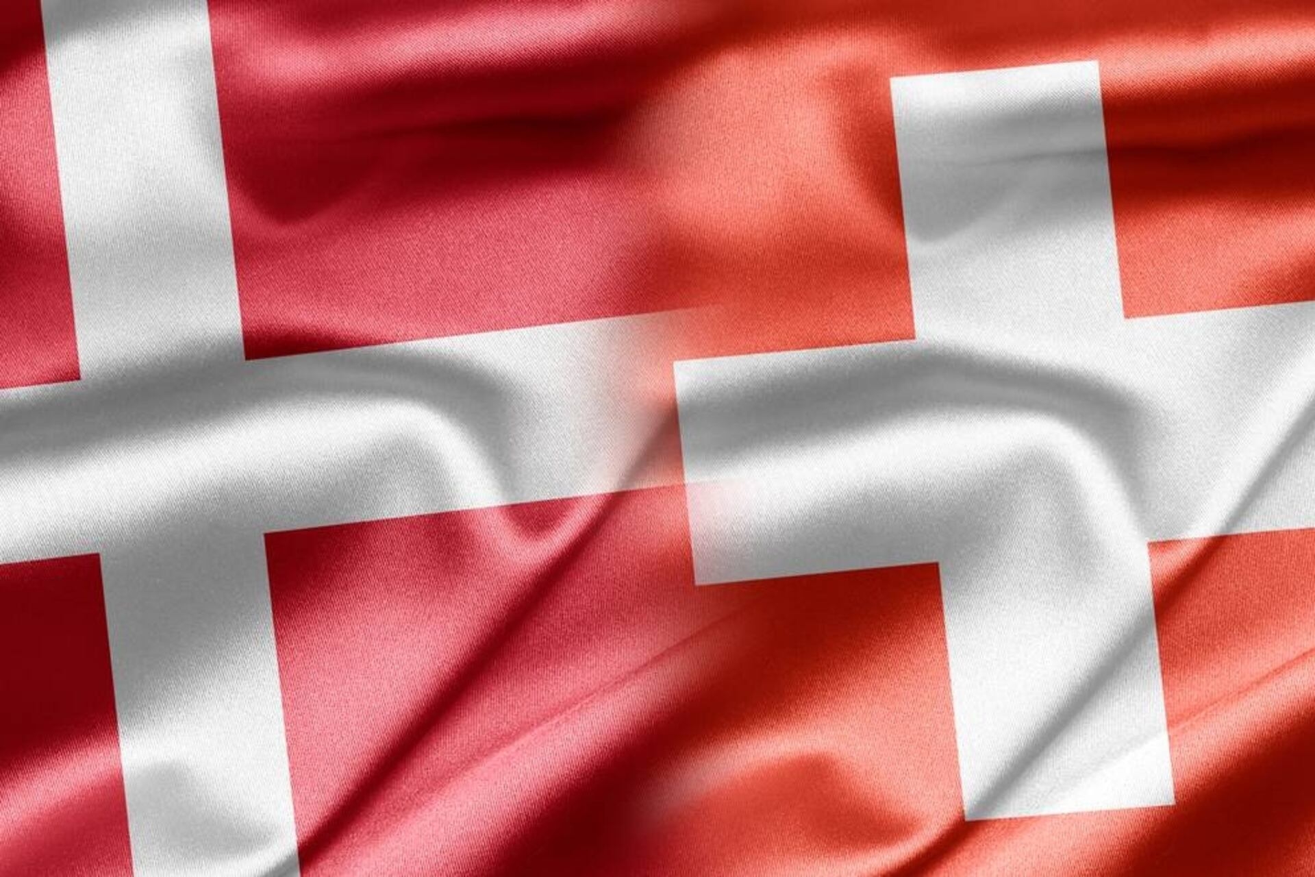 Šveicarija Danija: grafinis Konfederacijos ir Karalystės vėliavų susiliejimas
